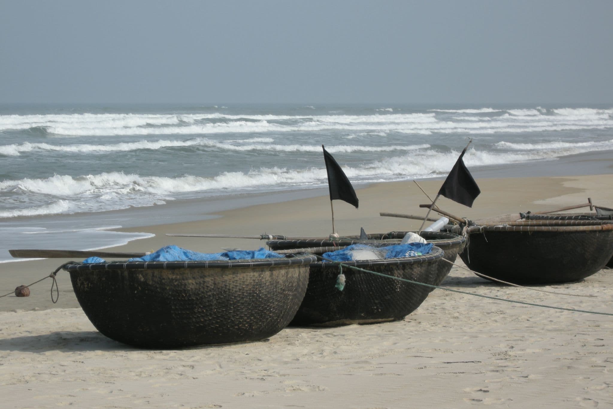 Traditional round coracle fishing boats on Non Nuoc beach near Da Nang