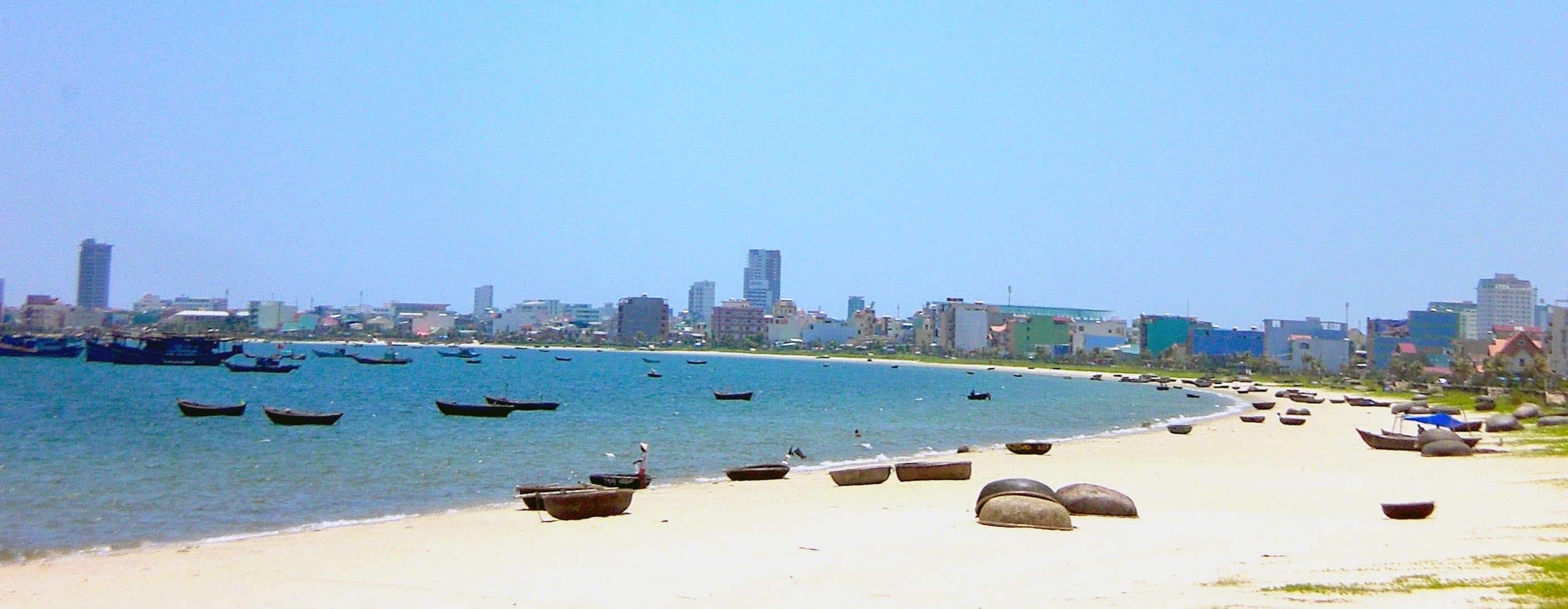 Calm inner-gulf coastline of Da Nang on a clear day
